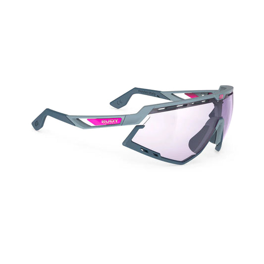 LUNETTE DEFENDER   Couleur : Glacier Matte Frame With ImpactX Photochromic 2 Laser Purple Lenses Blue Bumpers 2026