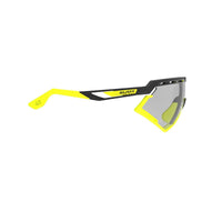 LUNETTES DEFENDER /MONTURE NOIRE MATE ET VERRES IMPACTX-2 PHOTOCHROMIQUES TRANSPARENTS À NOIR LASER PARE-CHOCS JAUNE FLUO E-LUNETTES RUDY PROJECT 